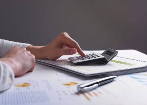 Analyzing Business Data - pen and numbers on paper