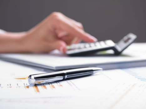 Market Analyze - pen and calculator on papers