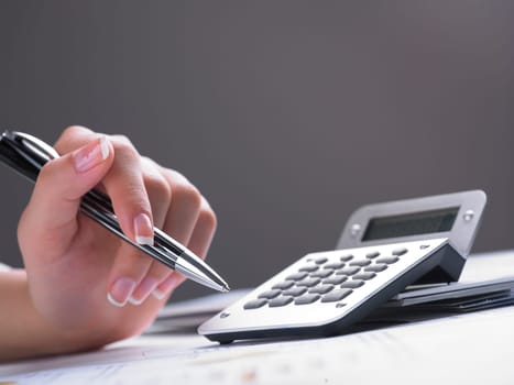 Market Analyze - pen and calculator on papers