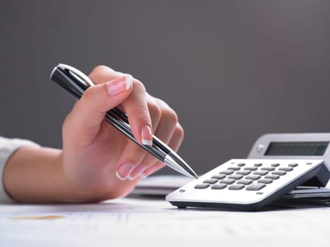 Market Analyze - pen and calculator on papers