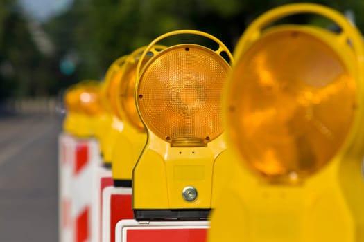 Construction site lamps in series