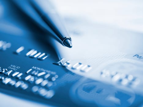 Close up a credit card and pen