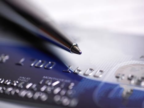 Close up a credit card and pen