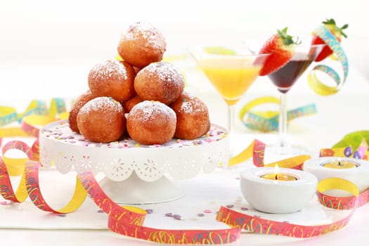 Small fried doughnut with cocktails for carnival
