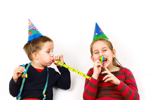 Carnival kids have a fun with noisemaker