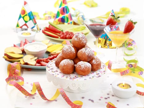 Small fried doughnut with cocktails for carnival