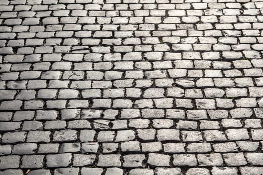 old historic cobble stone street with moss