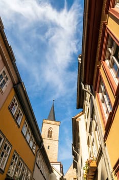 Houses on Kraemerbruecke - Merchants Bridge in Erfurt, Germany. Two narrow rows of houses are built along both sides of the bridge.