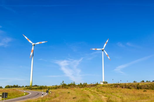Windmill gathers energy from the summer breeze.