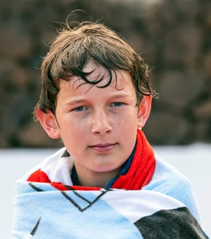 portrait of cute boy at the pool
