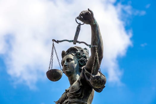 Statue of Lady Justice in front of the Romer in Frankfurt - Germany