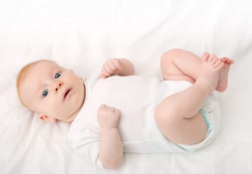 Newborn Baby Lying on Back on White Background