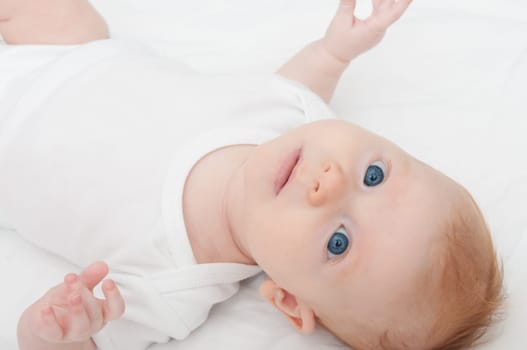 Newborn Baby Lying on Back on White Background