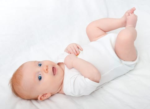 Newborn Baby Lying on Back on White Background