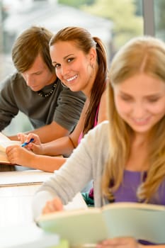 Teens study in high-school library reading student college learning campus