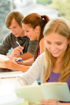Teens study in high-school library reading student college learning campus