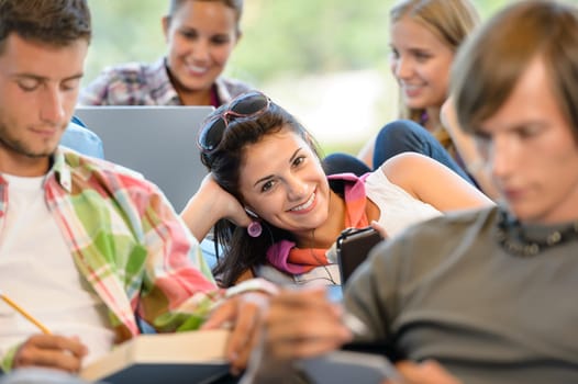 High-school pupils in study room music books smiling teens college