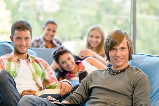High-school students in study room reading writing teens college young