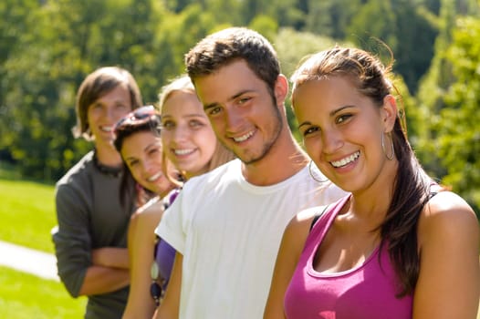 Teens smiling in the park campus students friends schoolyard leisure