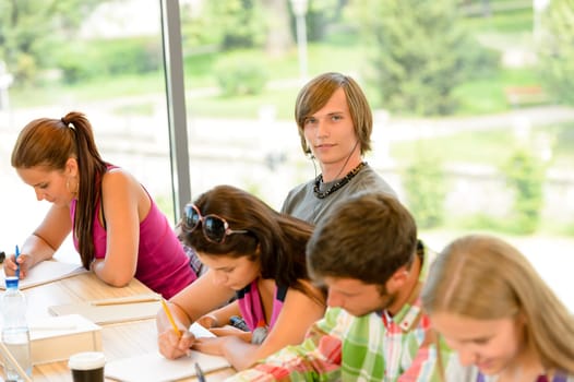 High-school students at lesson in class teens college writing young