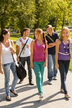 Students walking to school teens happy campus group youth friends