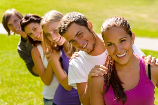 Students enjoying a break in the park fun teens campus