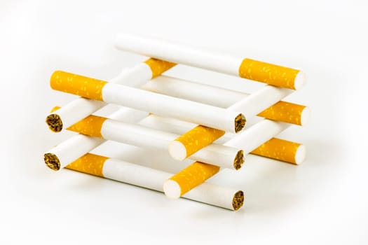Color photo of filter cigarettes isolated background, forming a house.