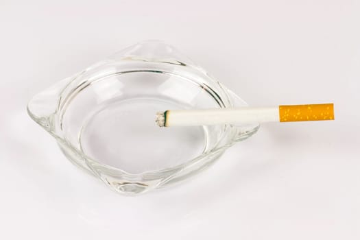 Color photo of filter cigarettes isolated background in an ashtray