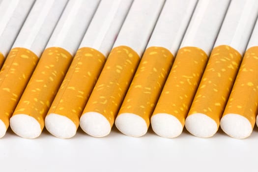 Color photo of filter cigarettes isolated background aligned by the filter