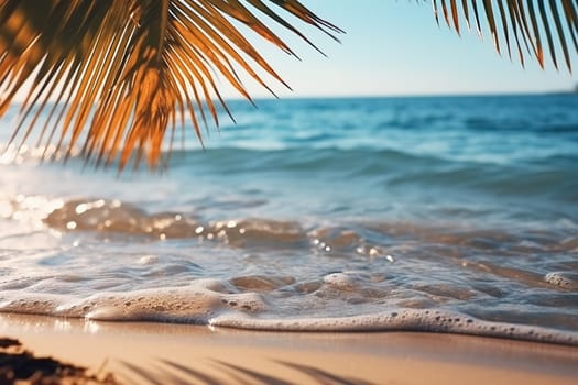 Palm leaves close-up against the backdrop of a seascape with waves. Vacation, travel, beach holiday concept.
