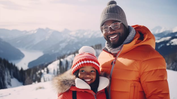 Happy, smiling, afro american family dad with daughter snowy mountains at ski resort, during vacation and winter holidays. Concept of traveling around the world, recreation, winter sports, vacations, tourism in the mountains and unusual places.