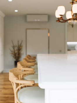 Kitchen white countertop with white marble, with blurred bokeh background. Presentation of goods in the kitchen interior on the countertop surface. 3D rendering