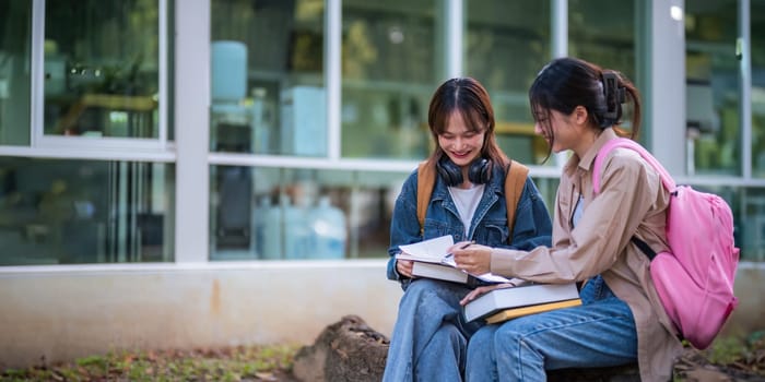 Happy young student chat with each other after class. girls wear casual clothes to study. Lifestyle College and University life concept, sincere emotions.