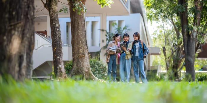 Student university friendship concept with classmate walking together at campus college park. Youth teenage and education.