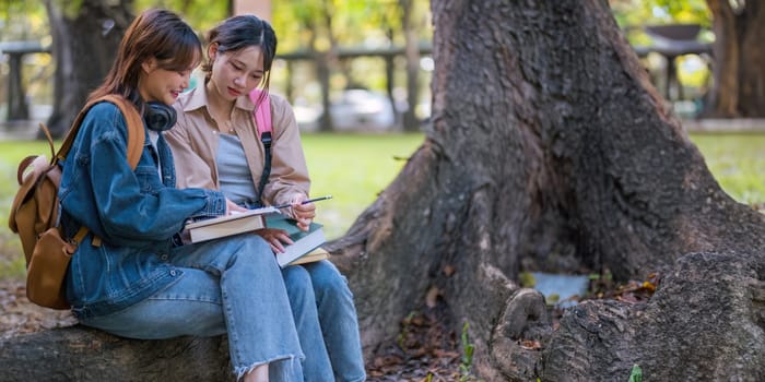 Happy young student chat with each other after class. girls wear casual clothes to study. Lifestyle College and University life concept, sincere emotions.