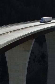 Semi-trailer truck crossing a high level bridge in British Columbia
