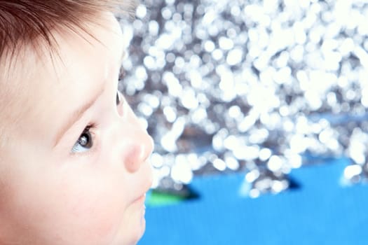 Close-up newborn with uncertain view with blurred background