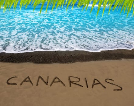 Brown beach sand with written word Canarias in Canary islands