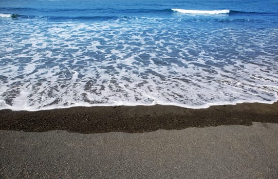 Canary Islands brown sand beach and tropical turquoise water