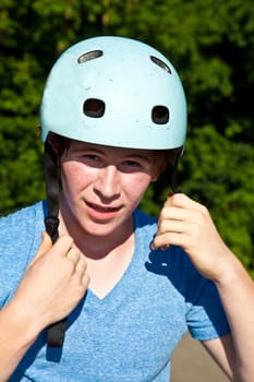 portrait of cute boy with helmet in the nature