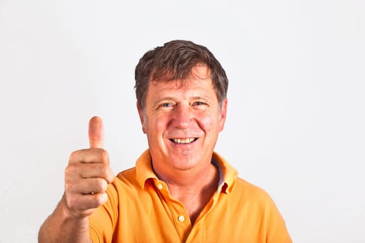attractive man giving finger sign in the studio