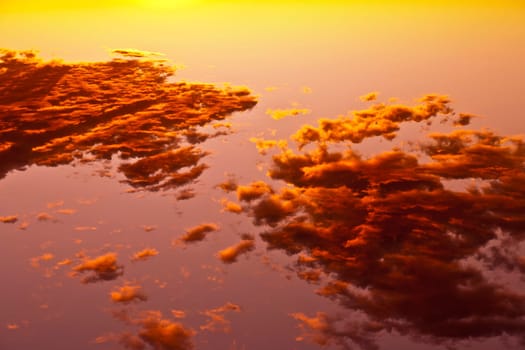 impressive sunset in the desert in Arizona with golden clouds