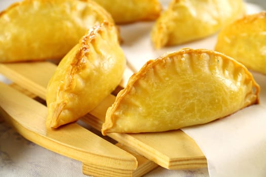 Delicious fresh baked golden cornish pasties ready to serve.
