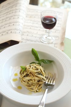 Delicious spaghetti with pesto with red wine ready to serve.