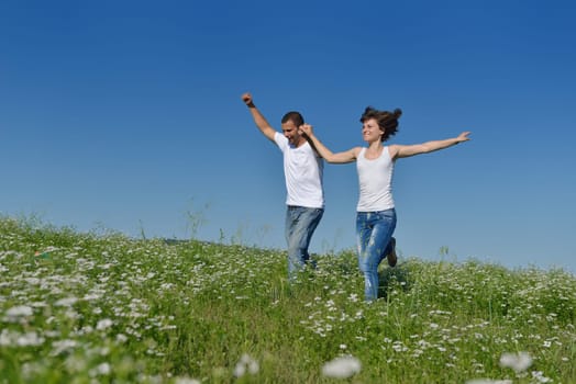 happy young couple in love have romance and fun at wheat field in summer