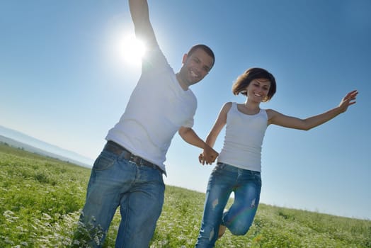 happy young couple in love have romance and fun at wheat field in summer