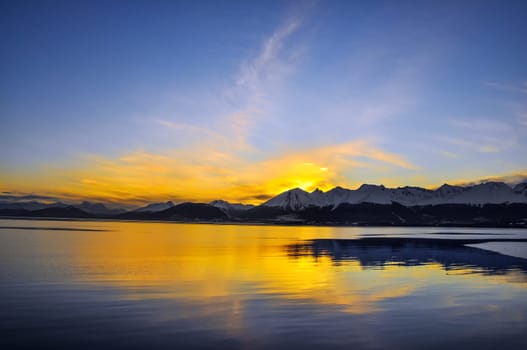 The sun going down behind the mountains near Ushuaia, Teirra del Fuego.