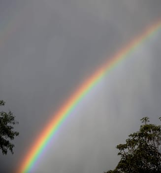 Beautiful rainbow on a stormy day. Concept of hope during tough times.