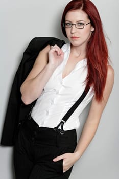 Beautiful young woman in smart business clothes in fashion style pose