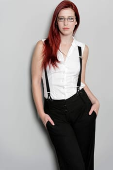 Beautiful young woman in smart business clothes in fashion style pose